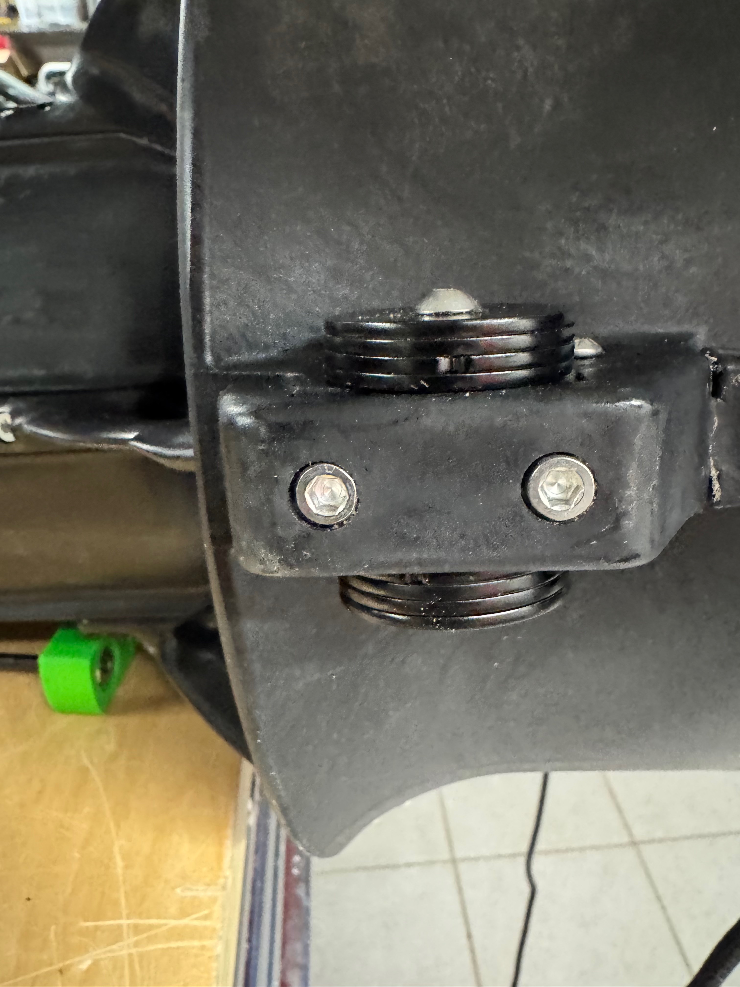 Reassembled weight disc bracket with 8 discs, bolt tightened