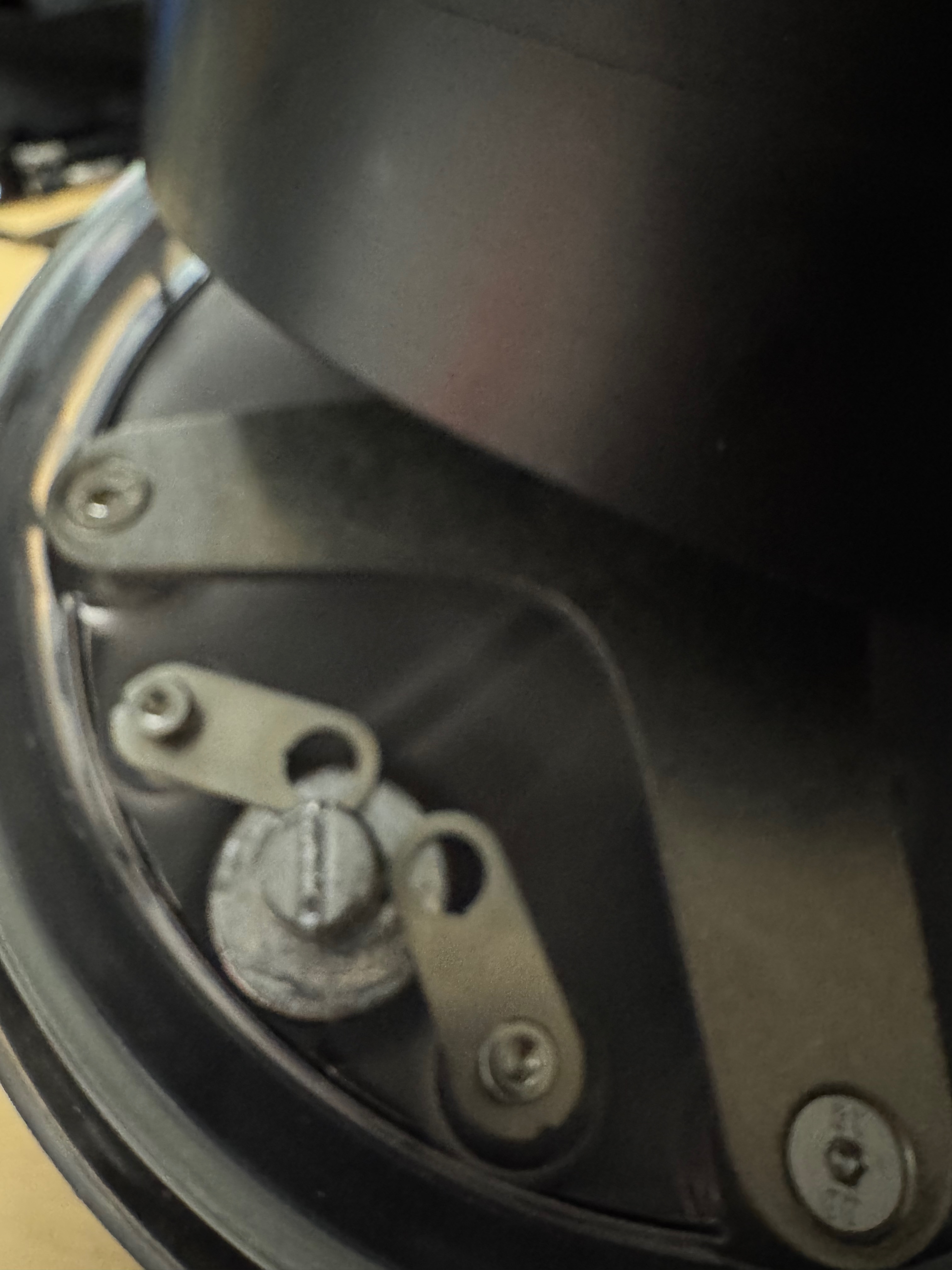 Close-up of the fresh water brass ballast and retaining bracket inside the SUEX body